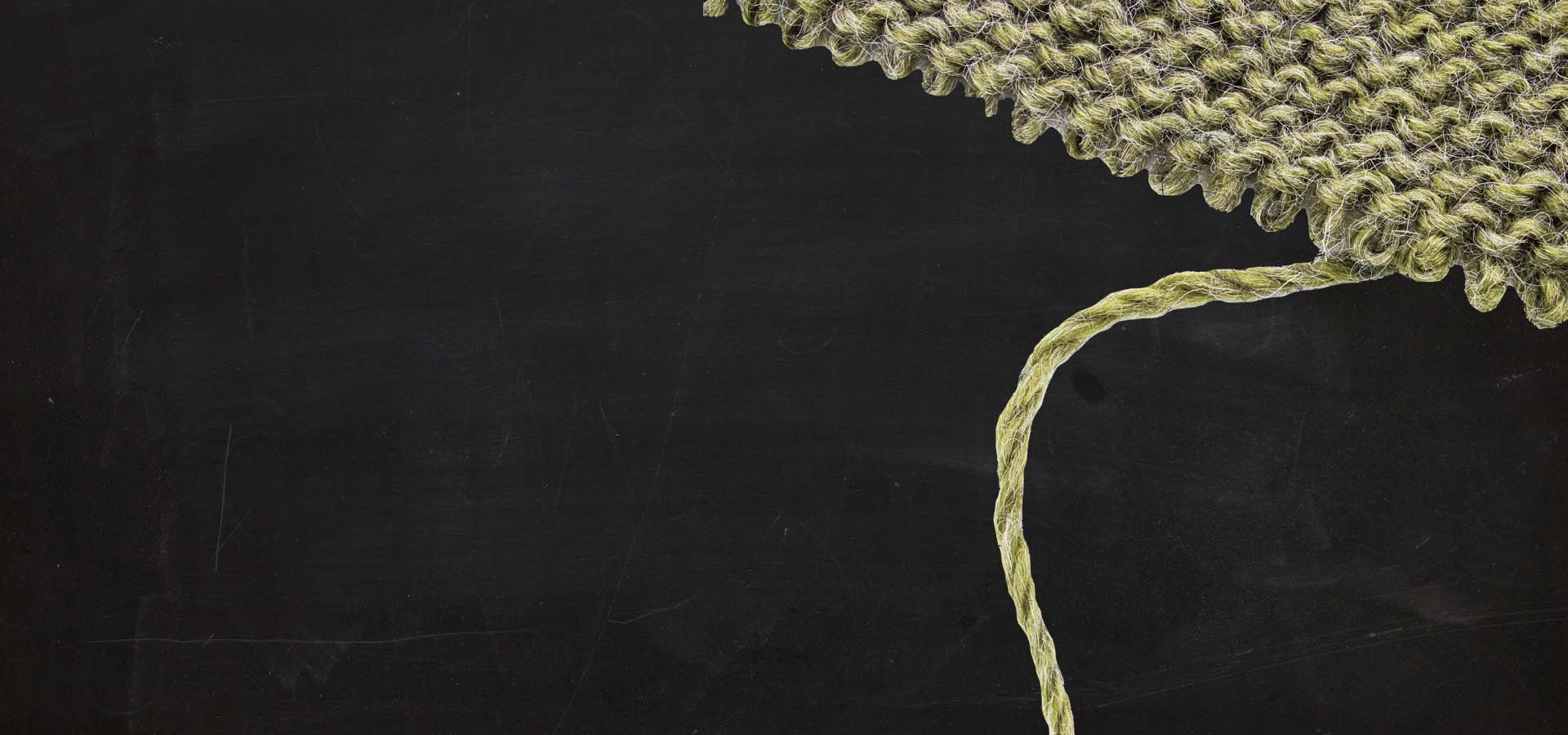 Textured green fabric on a black background